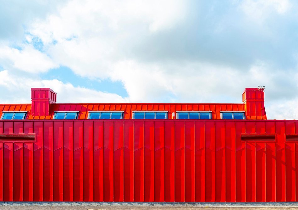 Vibrant red zinc highlights the community wing.