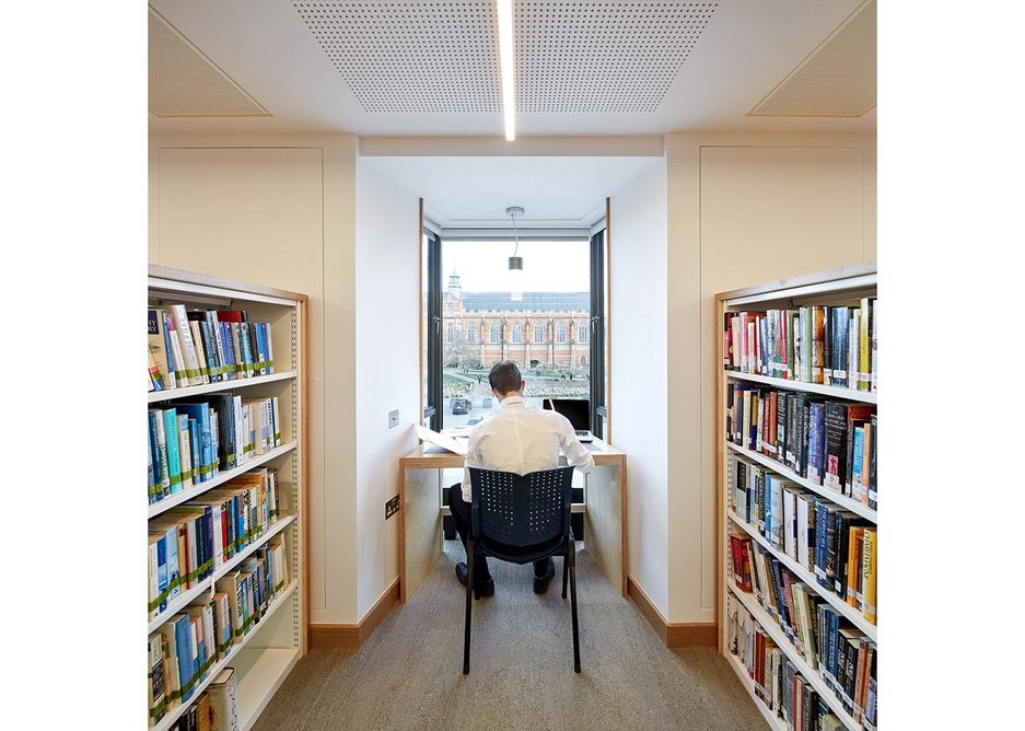 …have been replaced by eye-level shelving that creates views along the length of the building.