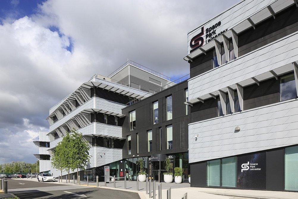 VM Zinc Azengar (engraved zinc) flat lock shingles and Anthra-Zinc standing seam facade panels at Space Park Leicester, University of Leicester. Shepheard Epstein Hunter architects.