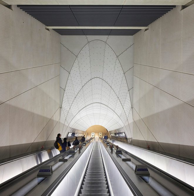 Escalators act as a portal to a subterrain world.