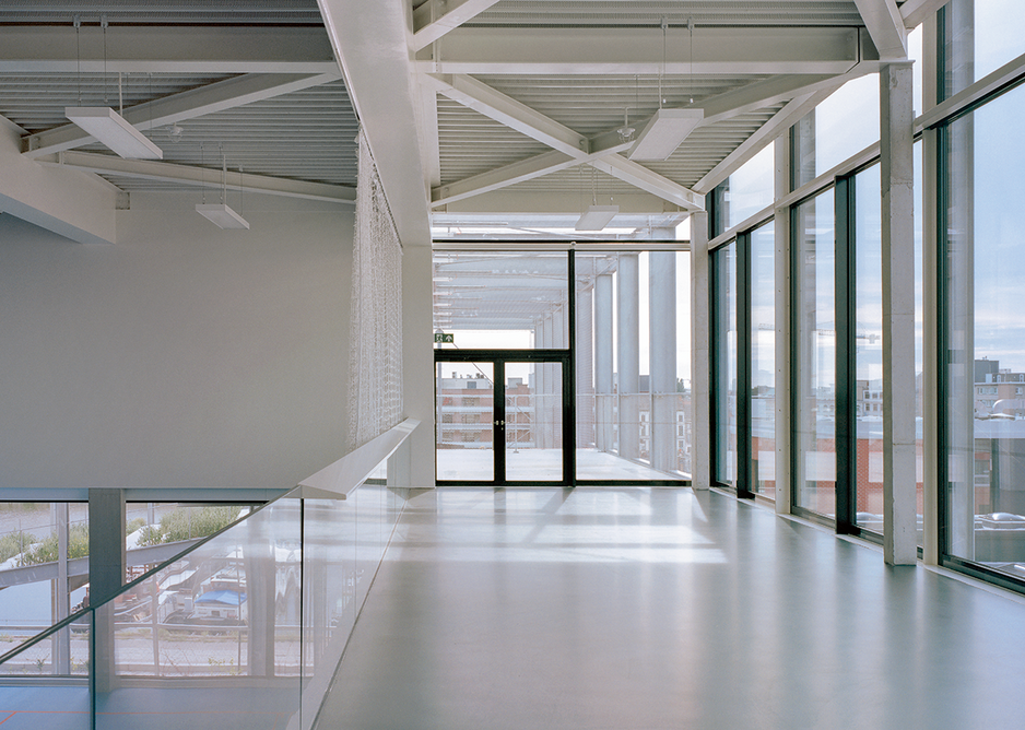 An internal grandstand over the sports hall leads directly to the playground spaces outside.