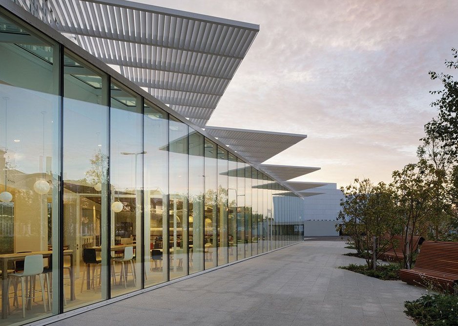 3.3m high double-glazed units facing south over the parking and landscaped area are the most open aspect of the building.