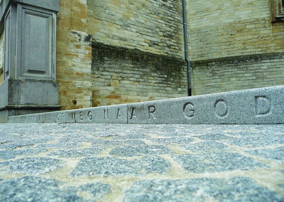 Averbode Abbey’s motto is carved into the vertical faces of the raised granite kerbs