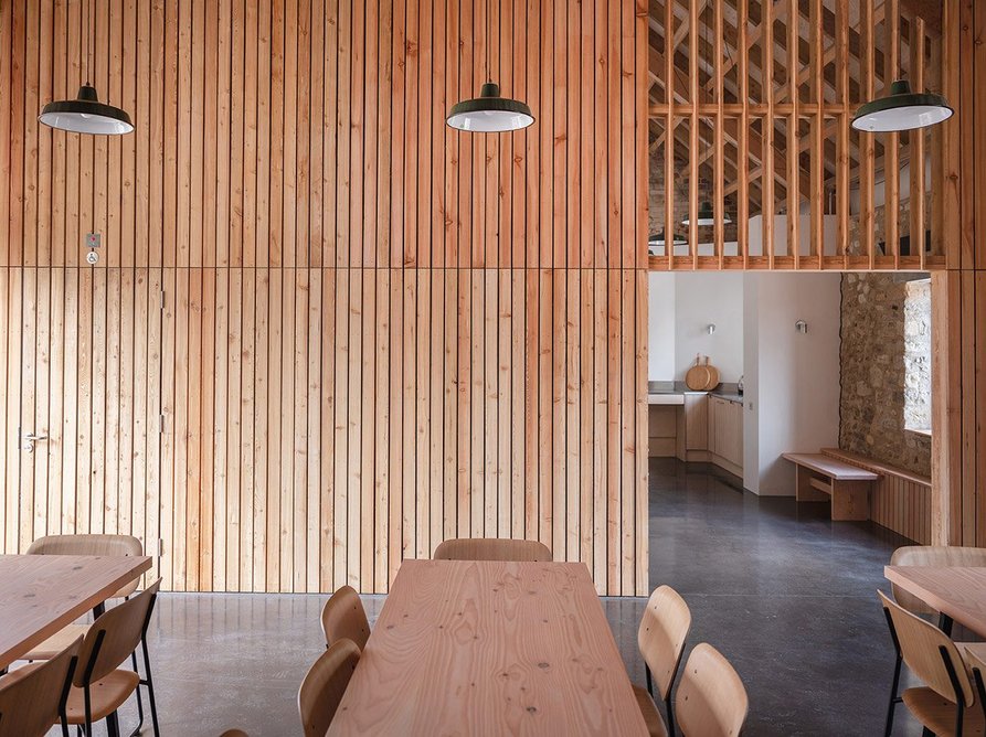 A timber-lined communal room and community space is accessed off the farmyard, to the south of the five holiday cottages arranged around a sheltered courtyard.