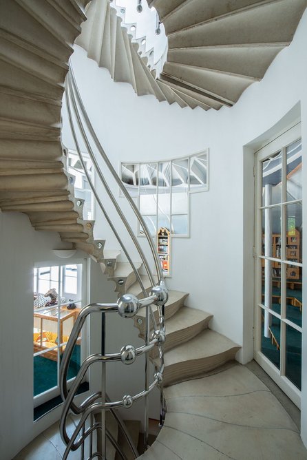 The Solar Stair is a cantilever concrete spiral with Eduardo Paolozzi’s Black Hole mosaic at the base.