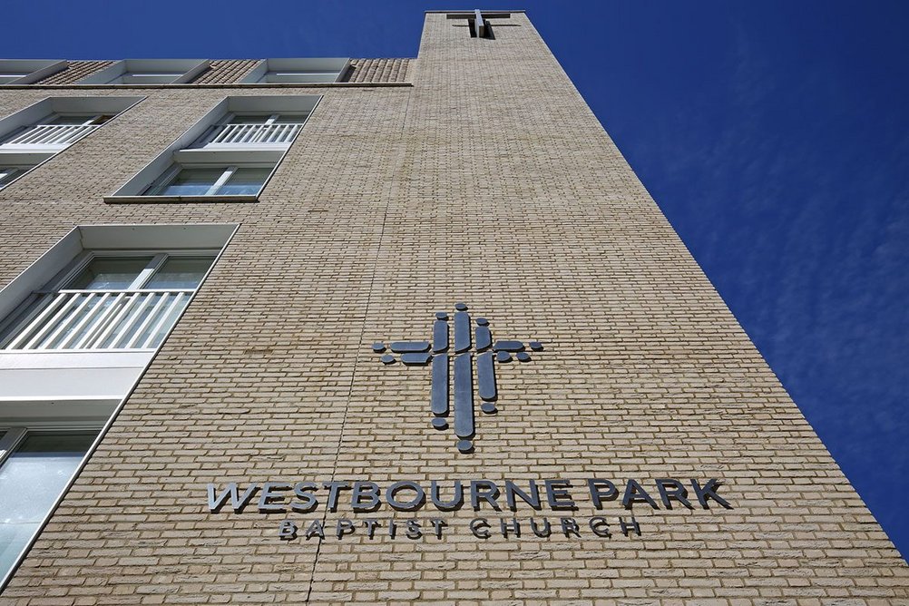 Evenly spaced vertical break lines help order the building's massing.