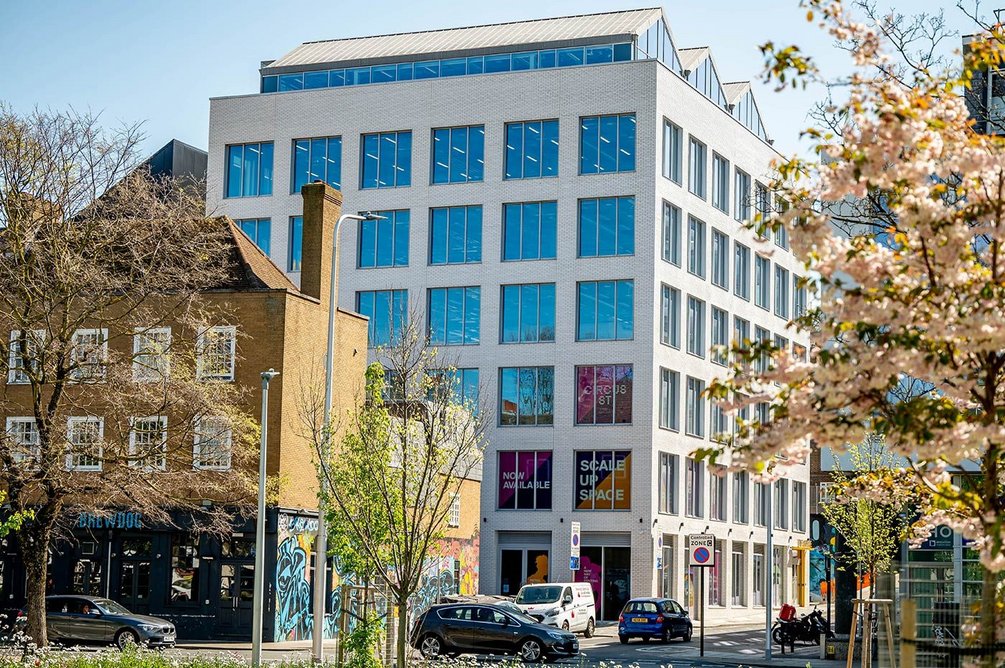 The folded roof of the office block alludes to the form of the market building that once occupied the site.