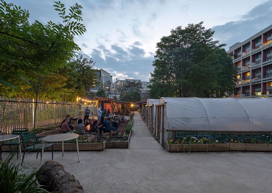 Evening event on the farm sandwiched between railway lines and flats. MacEwen Award shortlisted Waterloo City Farm, Lambeth, London by Feilden Fowles Architects. Peter Cook