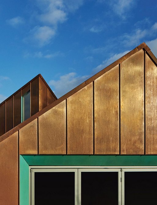 Pre-patinated copper reveals contrast with the main rainscreen cladding.