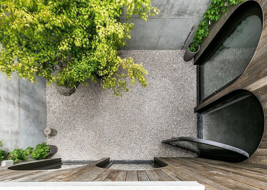 Looking down into the surprise courtyard from the walkway crossing to the front door from the street.