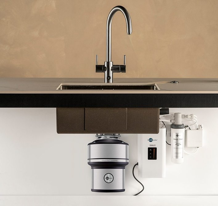 InSinkErator food waste disposers fit neatly under the sink.