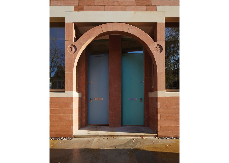 Red and white sandstone tie the entrances together.