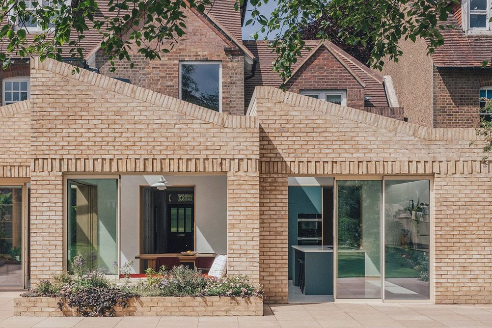 Handmade waterstruck bricks distinguish the rear extension.