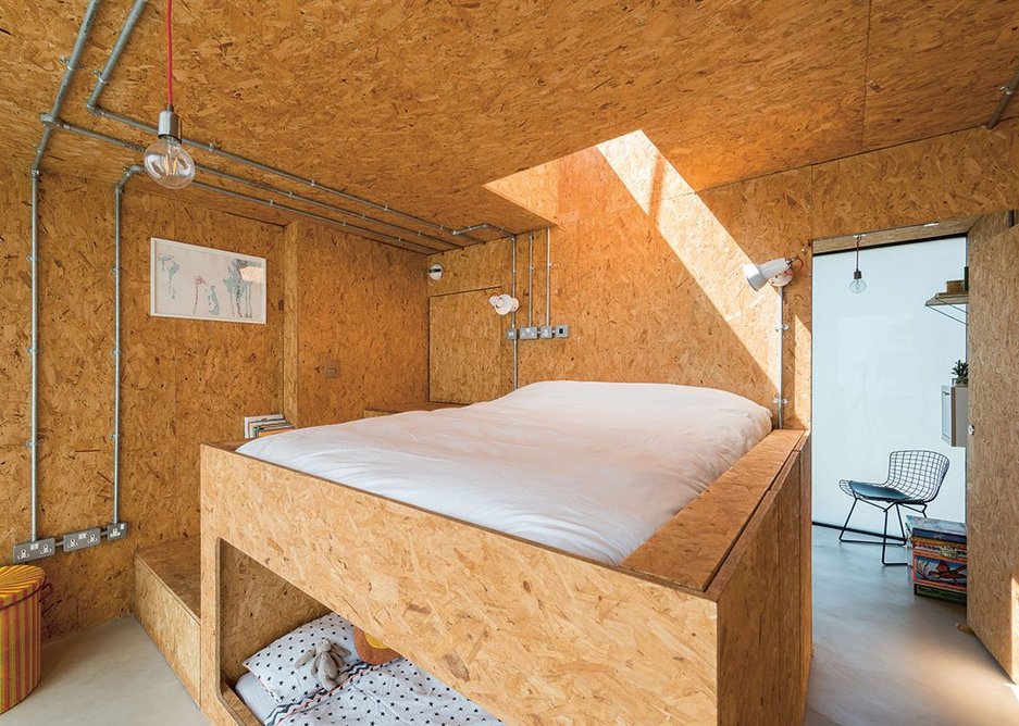 The upper level bedroom space, completely lined in SterlingOSB Zero, also has the main bed frame and children’s nook built from the material.