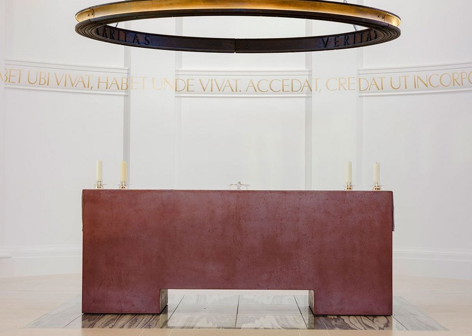 A red, Venetian plaster altar, by acclaimed ceramicist Julian Stair is the focal point of the church, below Barr’s cast iron ring of light. They sit on top of re-used green marble from the previous high altar.