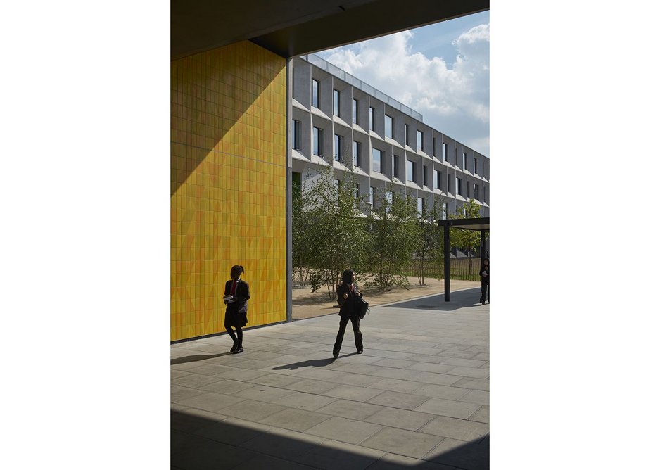 Modular facade system in the background and coloured tiles in the foreground paid for from a separate school budget.