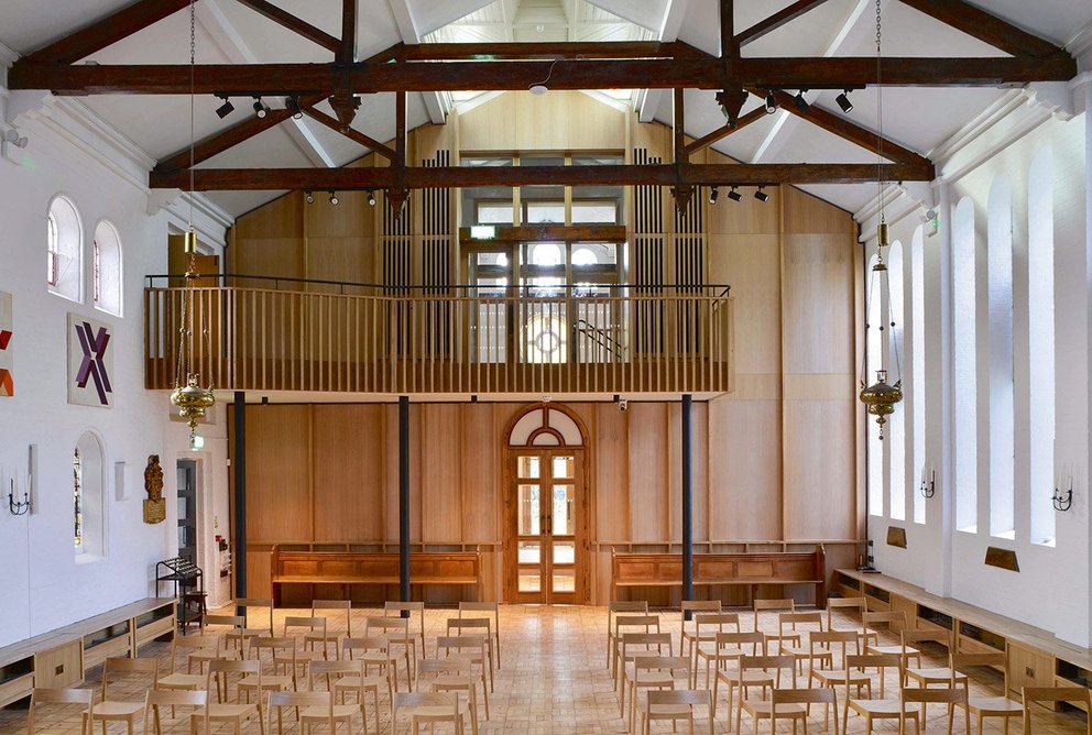 A new timber ‘rood screen’ separates worship from community spaces in CDB’s renovation of the listed St-Peter-in-the-Forest.