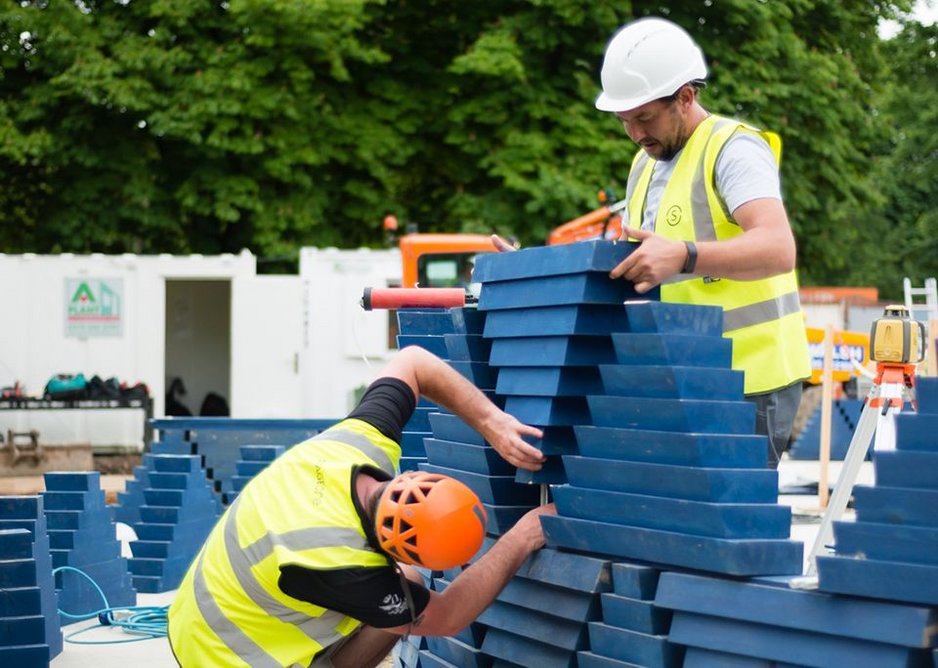 Slotting into place the stacked triangles that will make up the African-fabric pattern of Kéré’s Serpentine Pavilion.