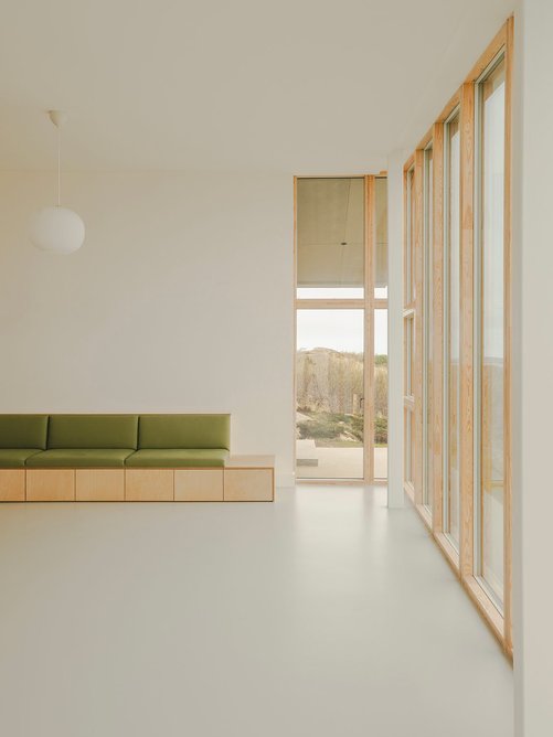 The interior is calm, gallery-like space that does not detract from or compete with the views.