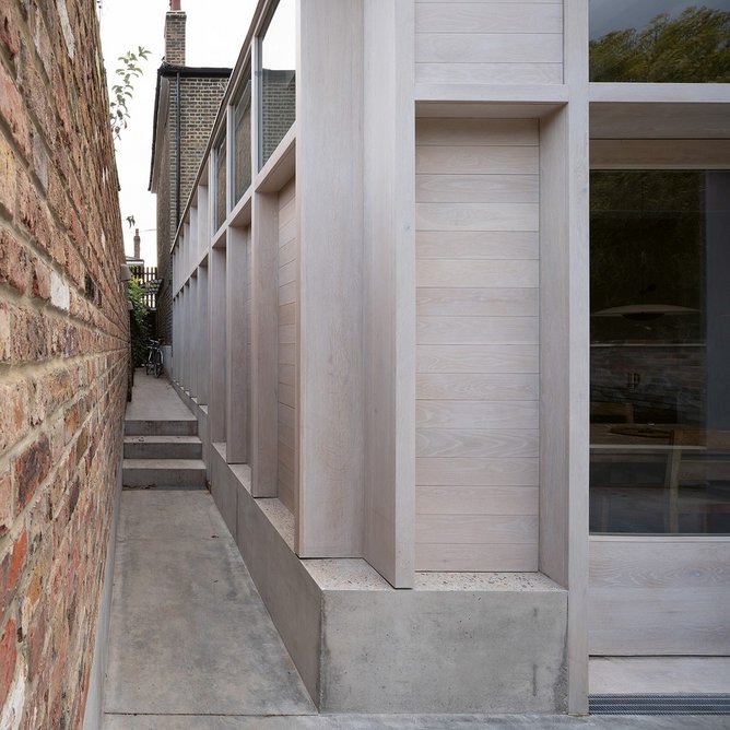 View down the side of the kitchen extension, formed by excavating to achieve more generous ceiling heights and inserting a concrete base tray.