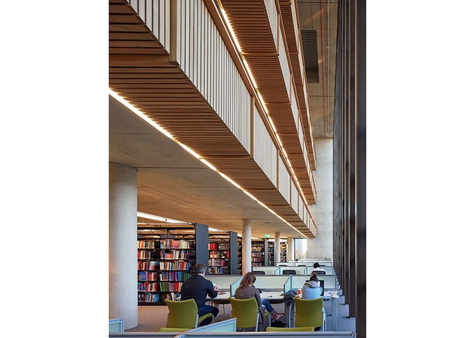 The library extension looking west along the north atrium. Where breakout noise might be expected, timber detailing helps deal with it.