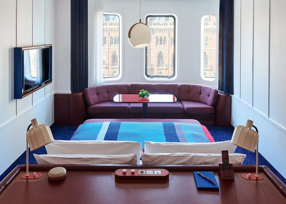 There’s a retro-future look to the hotel’s compact bedrooms – waffle slabs are exposed.