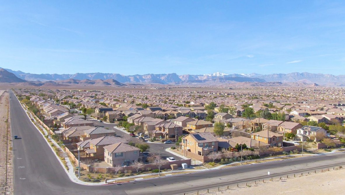 Real estate properties fill up the arid terrain in the Las Vegas suburbs that sprawl out across the Mojave Desert.