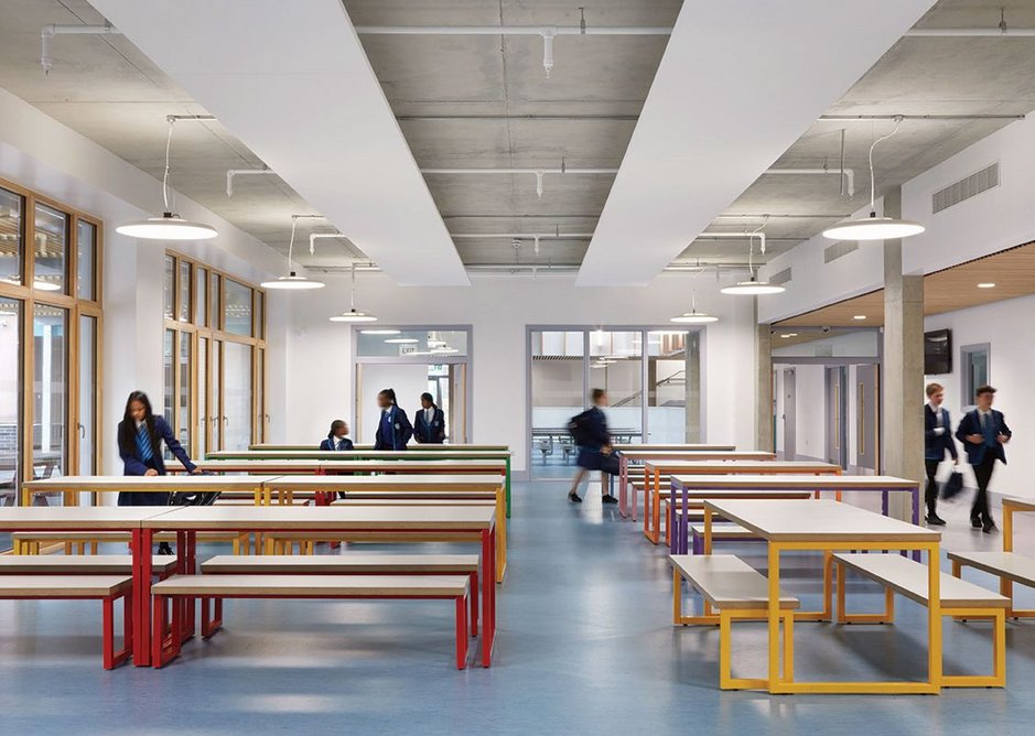 Aluminium composite windows abound in the more formal communal areas, providing greater tactility and warmth. Here in the refectory, they look out onto the east courtyard.