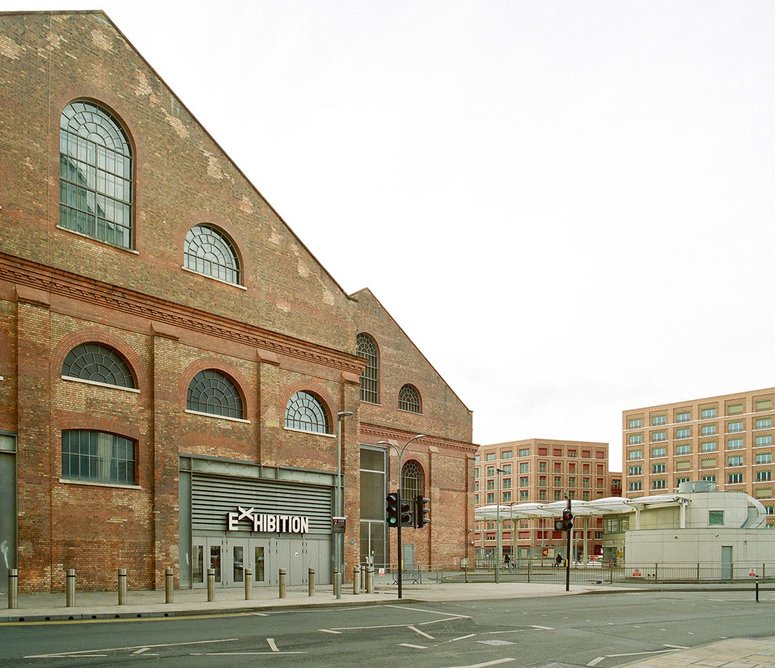 MacFarlane Place echoes the robust, brick presence of the nearby Dimco Buildings.