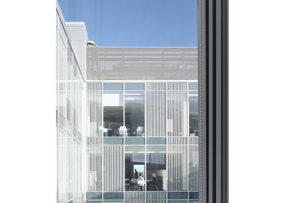Opaque and fritted screening to the internal courtyard glazed panels helps prevent solar gain.