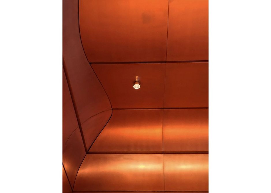 Light fixtures accord with the copper theme.