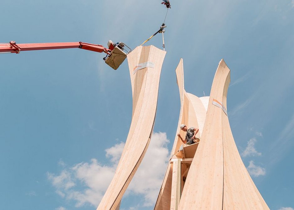 The timber boards were glued together into 5m by 1.2m spruce wood bilayer panels to be kiln-dried.