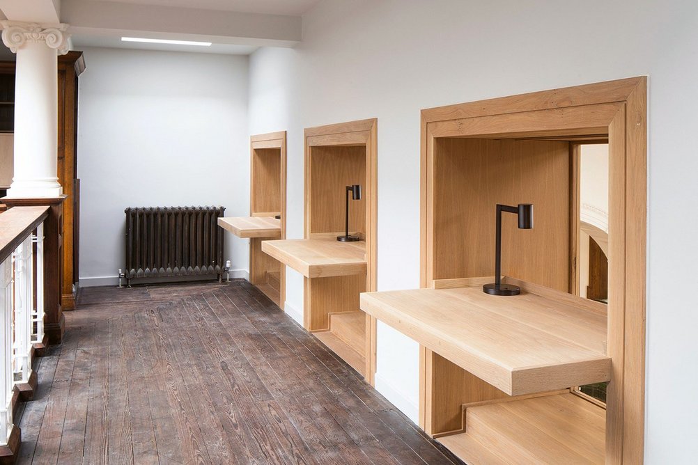 Crisply detailed oak hot desks on the upper level for community clubs or private hire.