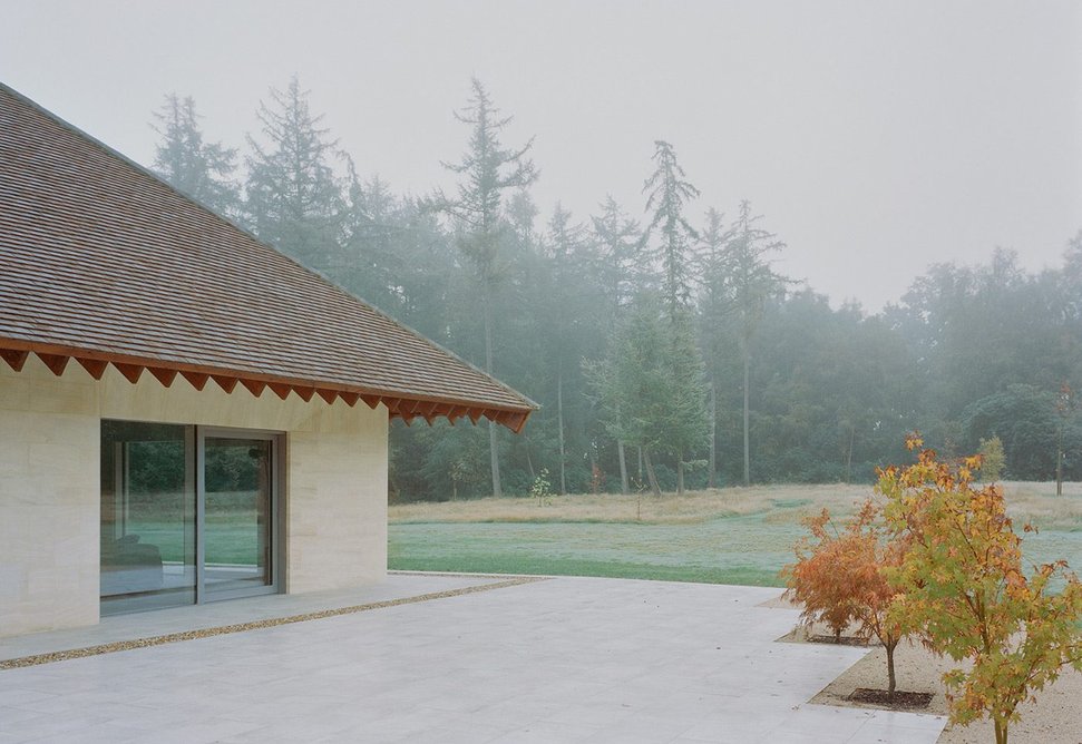 Rainwater falls from the roof into a ground drain and is used for the garden.