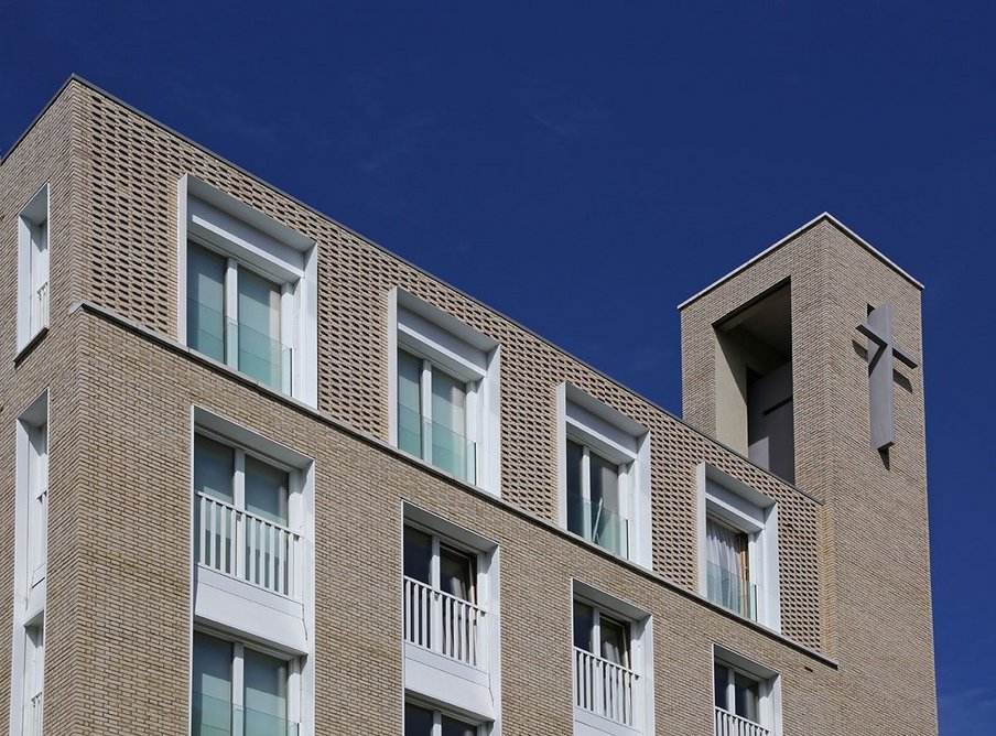 Pulled brick headers feature on the building’s top recessed storey.