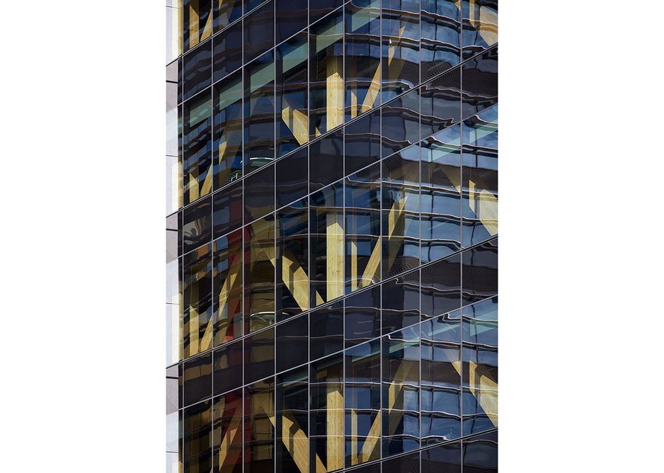 Office floors are set out on a six metre by eight metre grid of exposed glulam columns at Bates Smart’s 25 King timber tower, Brisbane, Australia.