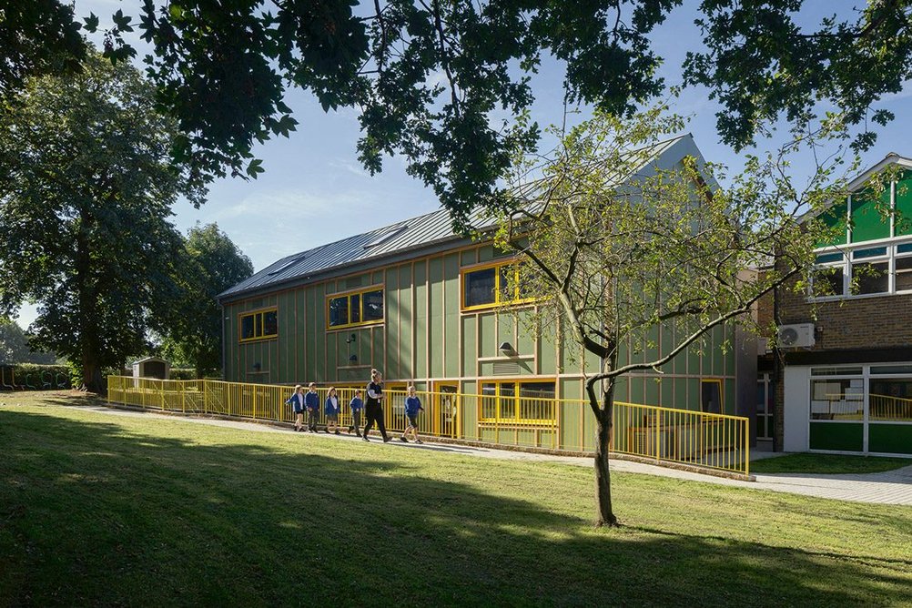 A play area has been created from scrubland behind the new block.