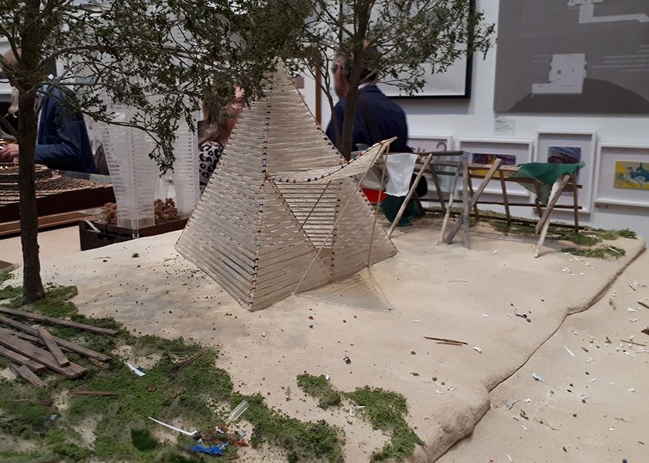 Shelter made from waste plastic bottles by small.