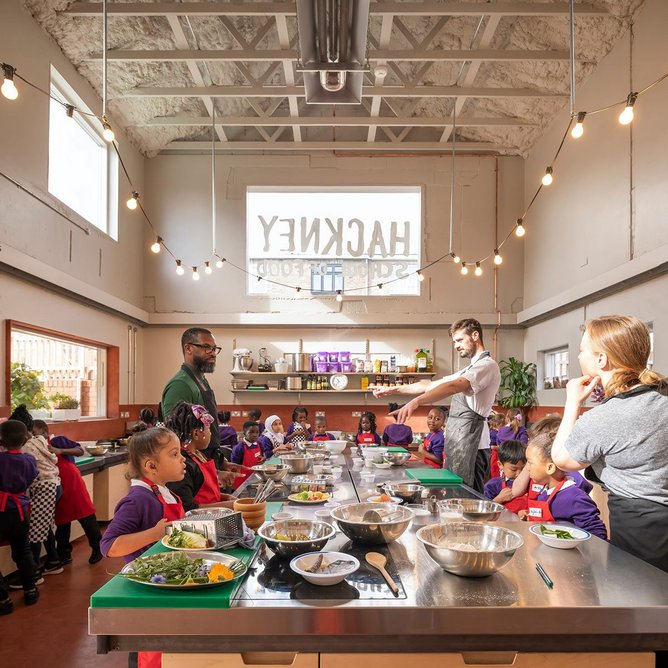 The converted caretaker’s cottage has had the internal walls and floors stripped out to create a big open professional kitchen for children and adults.