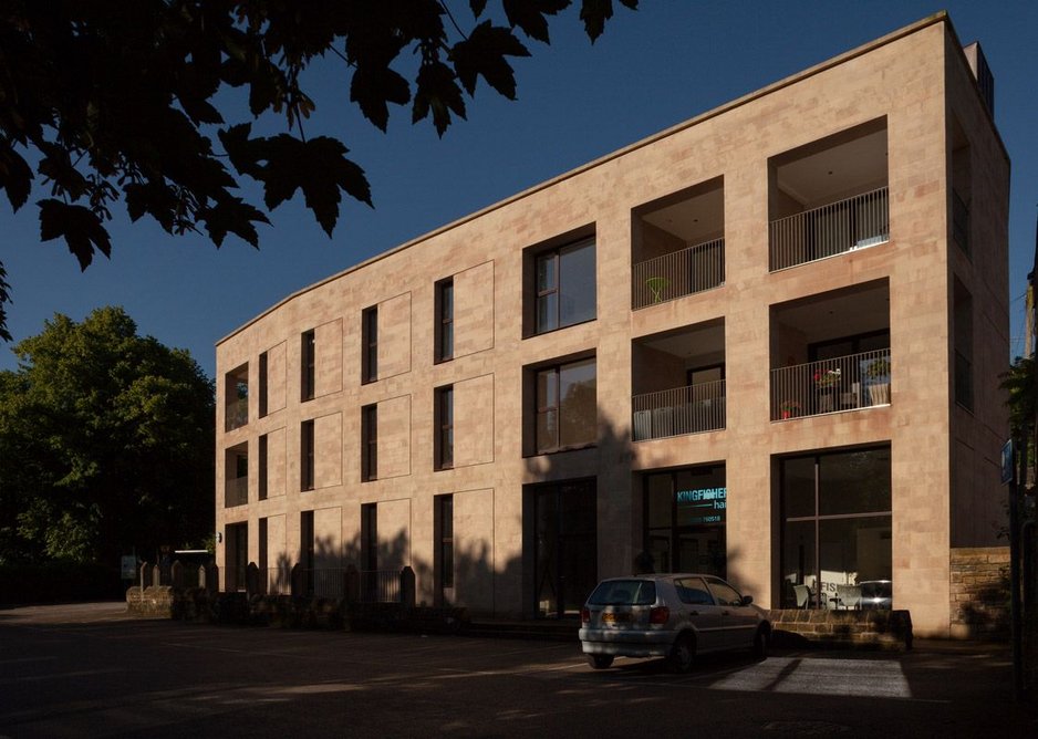 Commercial units at ground level, apartments with recessed balconies above