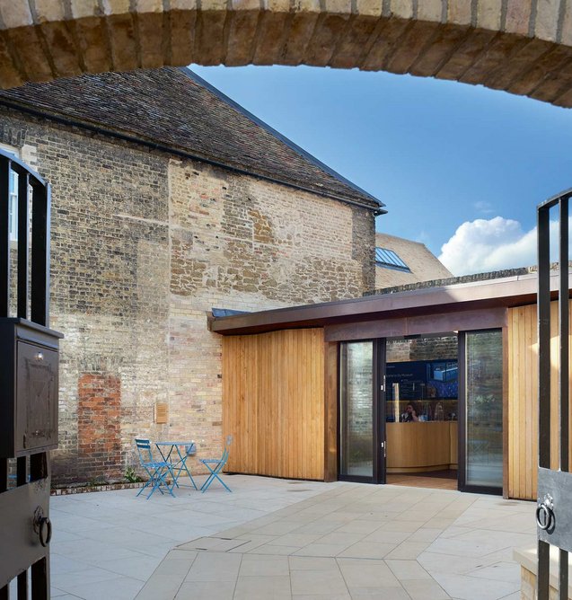 Felons’ Yard comfortably  receives visitors in its  timber and copper-clad  new entrance area.