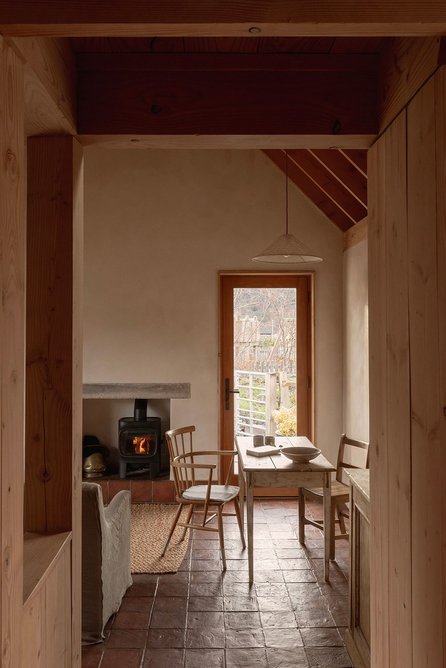A low entry area accentuates the height of the living room.