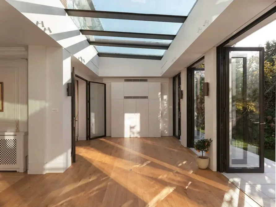 Adding a bespoke rooflight helps circulate air and prevent overheating in a traditional orangery in north London.
