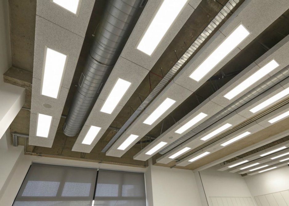 Heradesign ceiling rafts shown with exposed services and lighting.