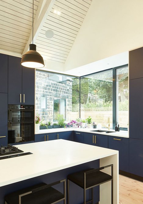 Corner glazing by Schüco maximises light and views in the kitchen/day room extension.