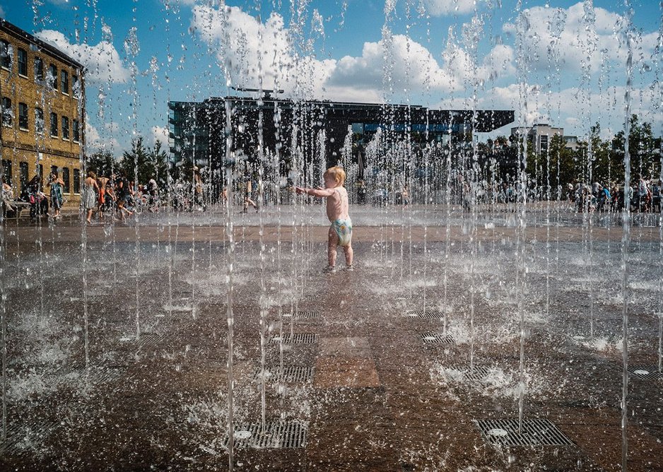The fountains in Granary Square become a local beach.