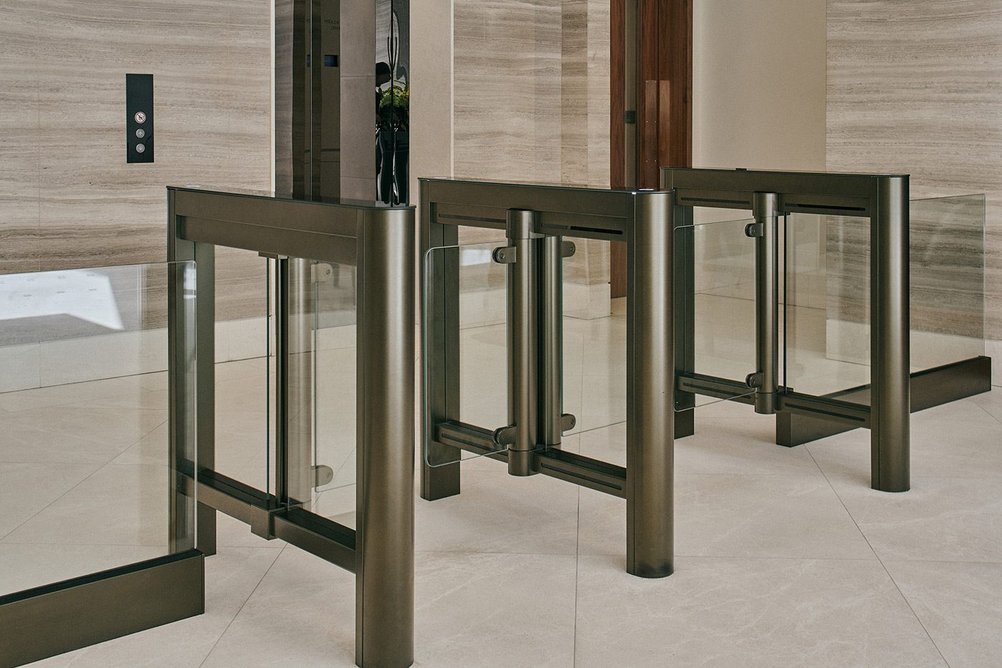 Meesons' EasyGate SG speed gates and balustrade shoes in Bradleys' Oiled Bronze architectural finish.