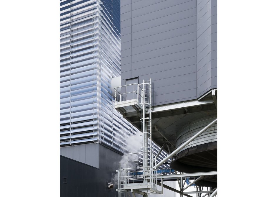 Darker cladding panels contrast with the boilerhouse...