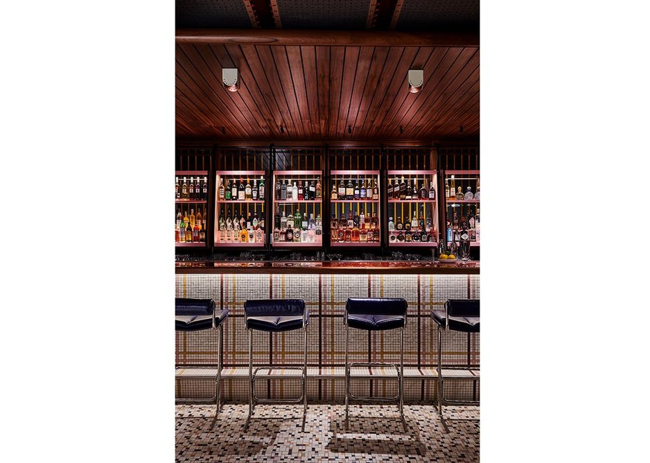 Timber and tile mosaic complete the bar’s 50s look.