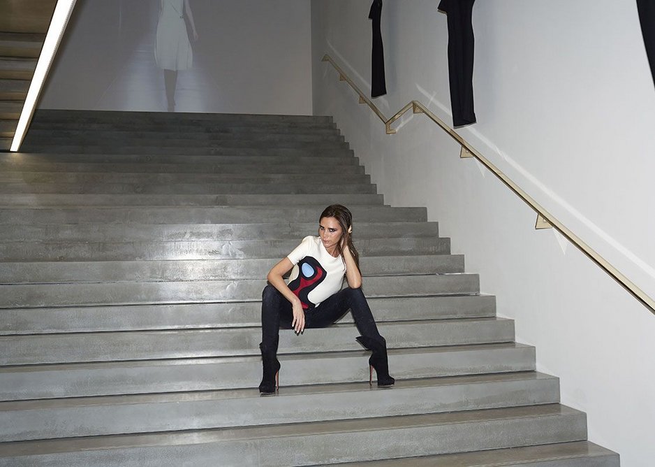 The owner displays her style on the sleek stair.